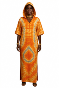 Woman wearing an orange tie-dye dress with a hood on a white background